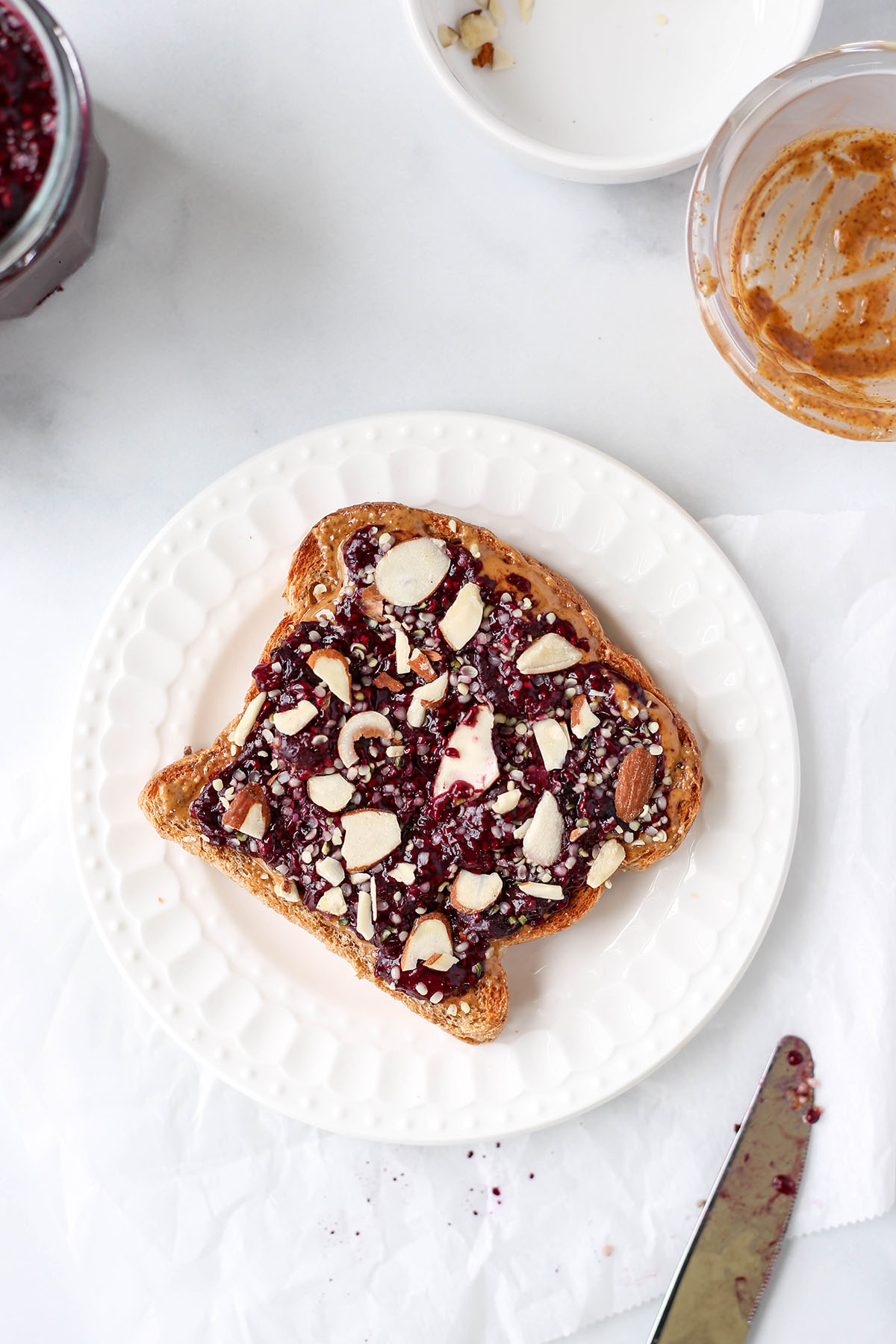 slice of toast with almond butter and chia jam on top