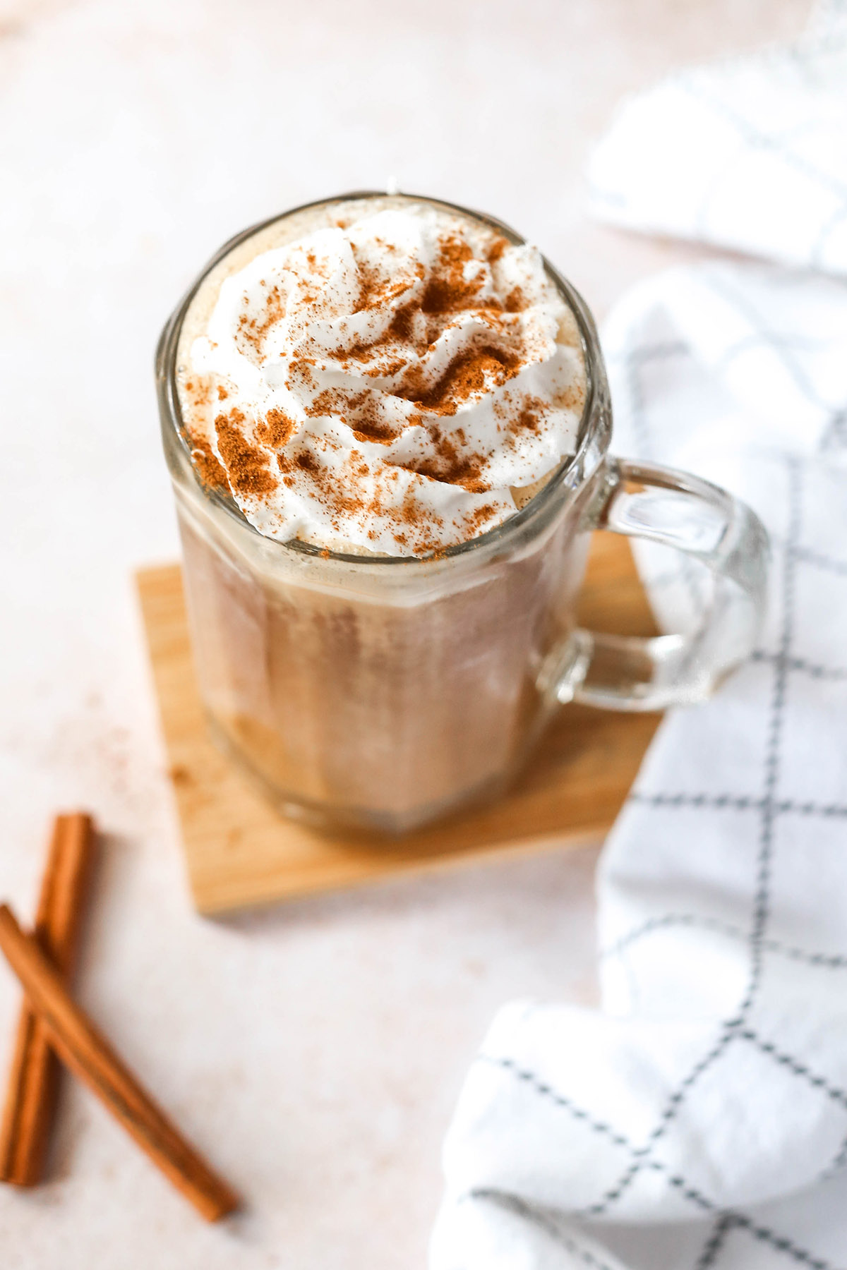 a pumpkin spice latte with whipped cream topping