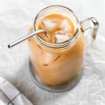 an overhead angle showing an iced almond milk latte in a mug