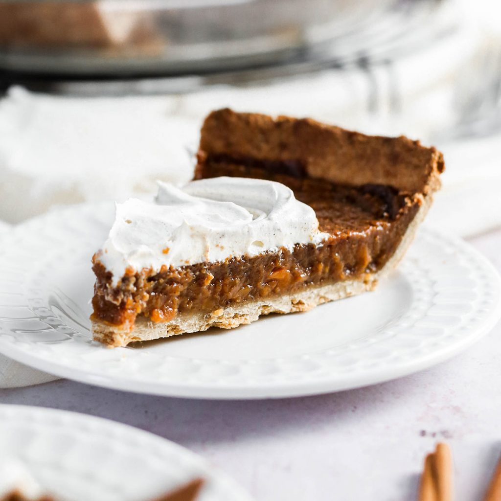 a slice of pie with whipped cream