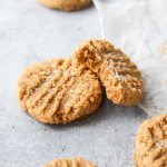 3-ingredient almond flour cookies stacked on top of each other.