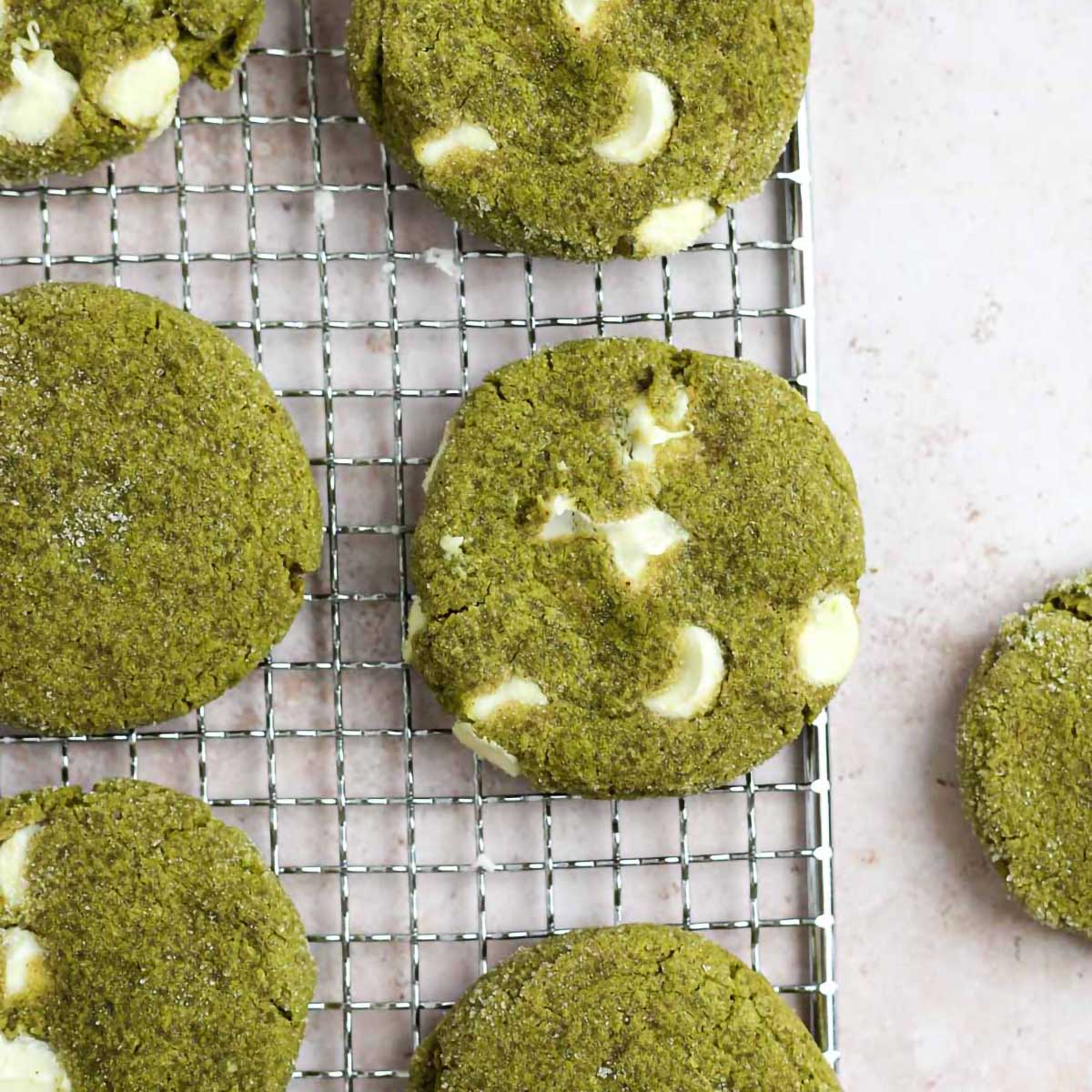 matcha white chocolate cookies on a wire cooling rack.